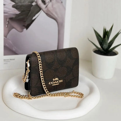 COACH Women’s Signature Canvas Mini Wallet on a Chain CZ278